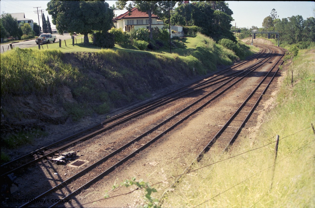 193-17
Gympie station yard entrance looking north towards Gympie North in the Down direction from the Stewart Terrace overbridge. [url=https://goo.gl/maps/zamovD9hxbu]GeoData[/url].
