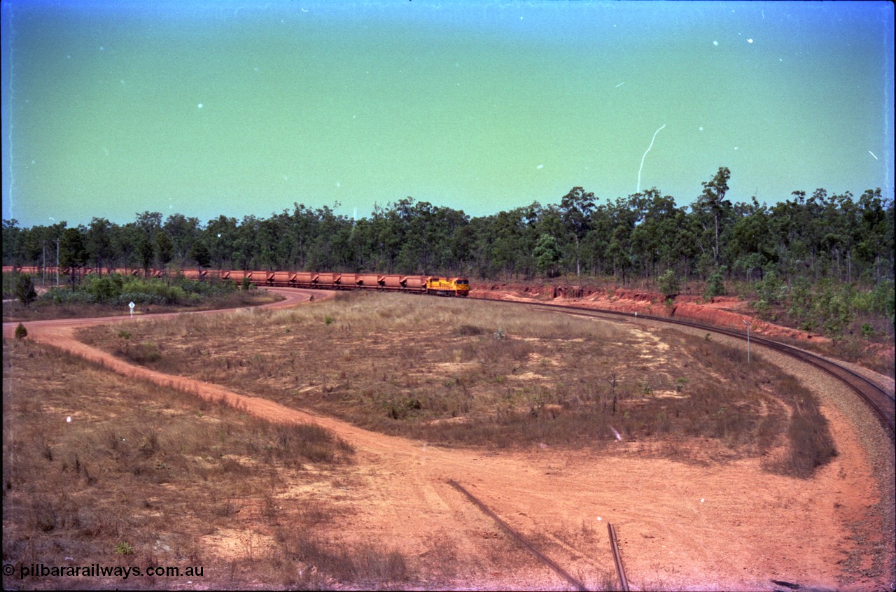 212-08
Weipa, a loaded train from Andoom Mine rounds the curve on approach to Lorim Point behind Comalco R 1004 Clyde Engineering EMD JT26C serial 90-1277 which is former Goldsworthy Mining loco GML 10.
Keywords: R1004;Clyde-Engineering-Kelso-NSW;EMD;JT26C;90-1277;Comalco;GML10;Cinderella;GML-class;