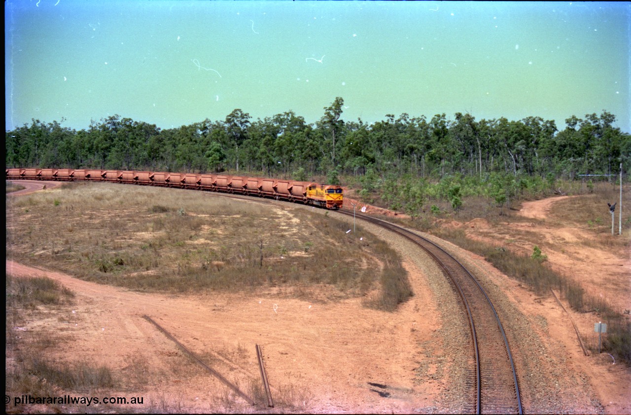 212-10
Weipa, a loaded train from Andoom Mine rounds the curve on approach to Lorim Point behind Comalco R 1004 Clyde Engineering EMD JT26C serial 90-1277 which is former Goldsworthy Mining loco GML 10.
Keywords: R1004;Clyde-Engineering-Kelso-NSW;EMD;JT26C;90-1277;Comalco;GML10;Cinderella;GML-class;