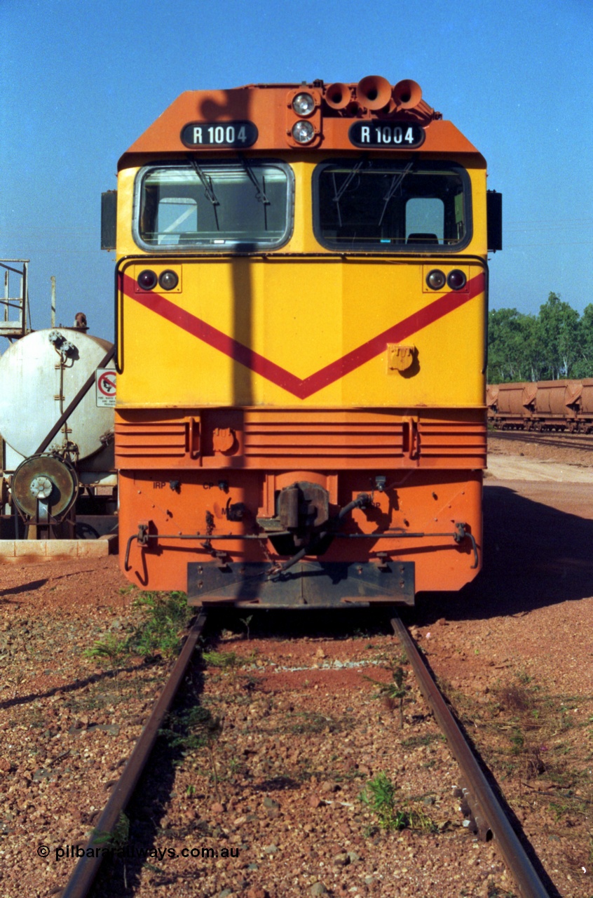 213-23
Weipa, Lorim Point fuel point, Comalco R 1004 loco Clyde Engineering built EMD model JT42C built 1990 serial 90-1277, weight 132 tonne, engine 12-710G3A, generator AR11-WBA-CA5, traction motors D87ETR, rated power 2460 kW/3300 hp. The body is similar to a V/Line N class while the components are the same as the Australian National AN class. Originally built for Goldsworthy Mining as GML 10 for use at their Western Australian iron ore railway and locally known as Cinderella. Purchased by Comalco in 1994 following the takeover of Goldsworthy by BHP.
Keywords: R1004;Clyde-Engineering-Kelso-NSW;EMD;JT26C;90-1277;Comalco;GML10;Cinderella;GML-class;