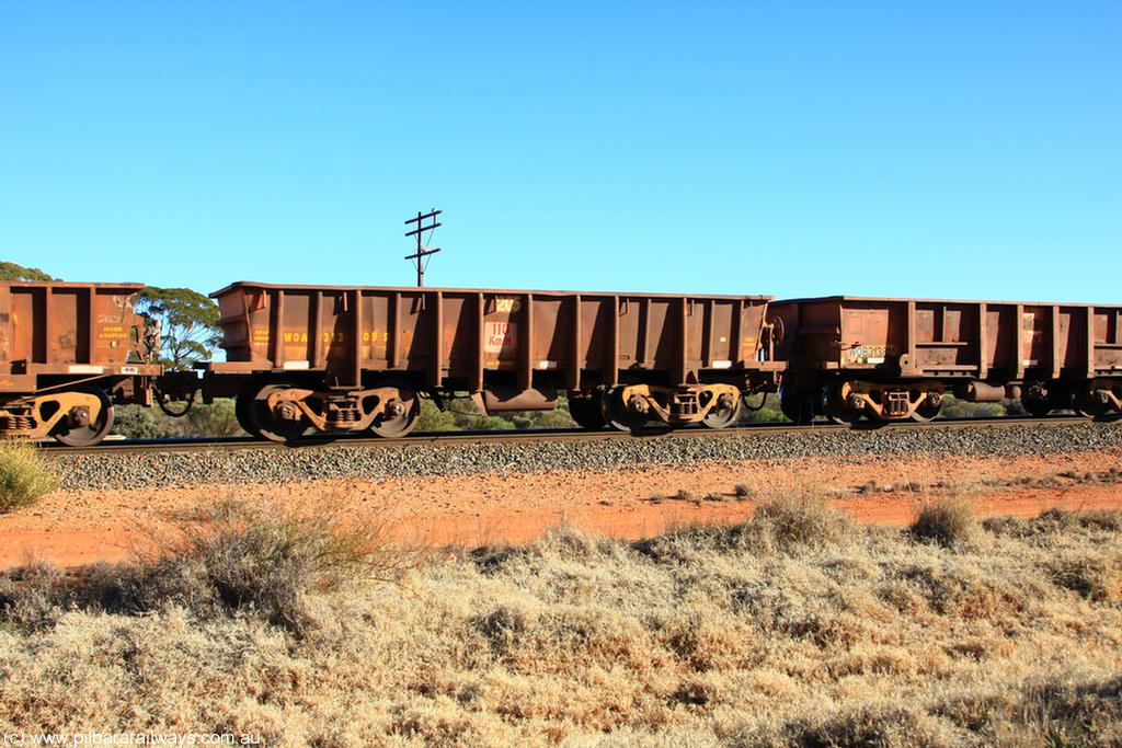 100731 02526
WOA type iron ore waggon WOA 31309 is one of a batch of thirty nine built by WAGR Midland Workshops between 1970 and 1971 with fleet number 205 for Koolyanobbing iron ore operations, with a 75 ton and 1018 ft³ capacity, on empty train 6418 at Binduli Triangle, 31st July 2010.
Keywords: WOA-type;WOA31309;WAGR-Midland-WS;