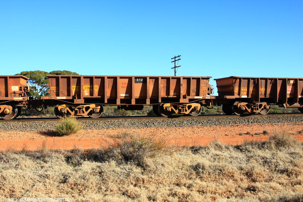 100731 02527
WOD type iron ore waggon WOD 31449 is one of a batch of sixty two built by Goninan WA between April and August 2000 with serial number 950086-021 and fleet number 512 for Koolyanobbing iron ore operations with a 75 ton capacity for Portman Mining to cart their Koolyanobbing iron ore to Esperance, now with PORTMAN painted out, on empty train 6418 at Binduli Triangle, 31st July 2010.
Keywords: WOD-type;WOD31449;Goninan-WA;950086-021;