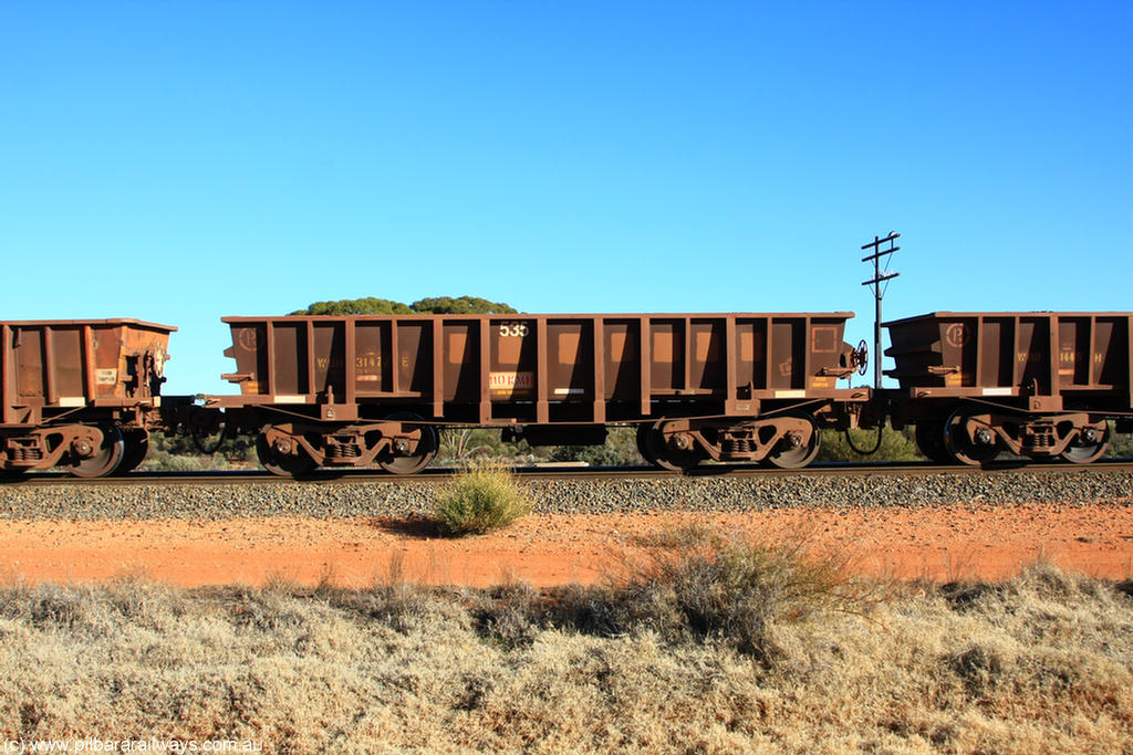 100731 02530
WOD type iron ore waggon WOD 31472 is one of a batch of sixty two built by Goninan WA between April and August 2000 with serial number 950086-044 and fleet number 535 for Koolyanobbing iron ore operations with a 75 ton capacity for Portman Mining to cart their Koolyanobbing iron ore to Esperance, now with PORTMAN painted out, on empty train 6418 at Binduli Triangle, 31st July 2010.
Keywords: WOD-type;WOD31472;Goninan-WA;950086-044;