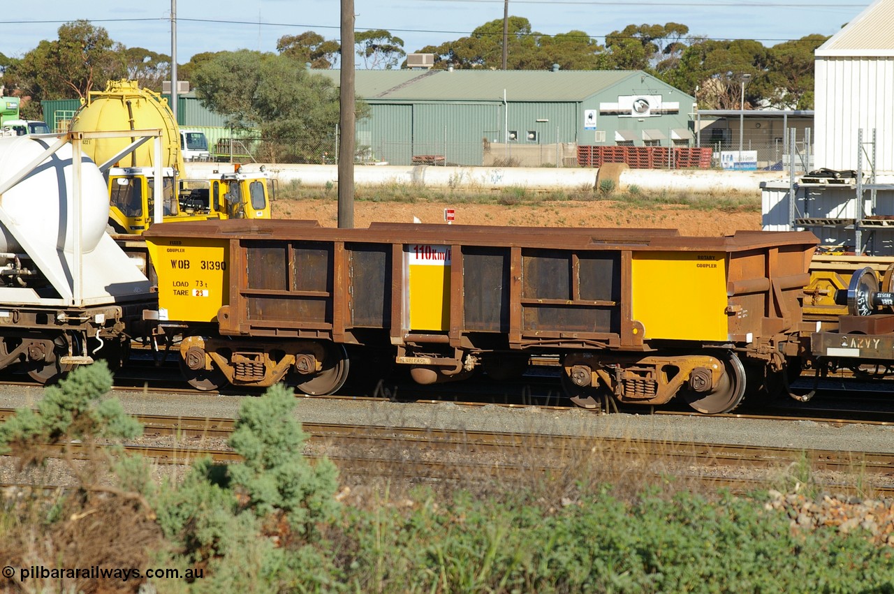 PD 12598
West Kalgoorlie, WOB type iron ore waggon WOB 31390 is one of a batch of twenty five built by Comeng WA between 1974 and 1975 and converted from Mt Newman high sided waggons by WAGR Midland Workshops with a capacity of 67 tons with fleet number 315 for Koolyanobbing iron ore operations and is one of the 15 converted to WSM type ballast hoppers by re-fitting the removed top section of the body and fitting bottom discharge doors. Converted back to WOB in 1997, fleet number not yet applied and having been fully re-sheeted and painted with the new angled lip applied to the top of the body.
Keywords: Peter-D-Image;WOB-type;WOB31390;Comeng-WA;WSM-type;Mt-Newman-Mining;