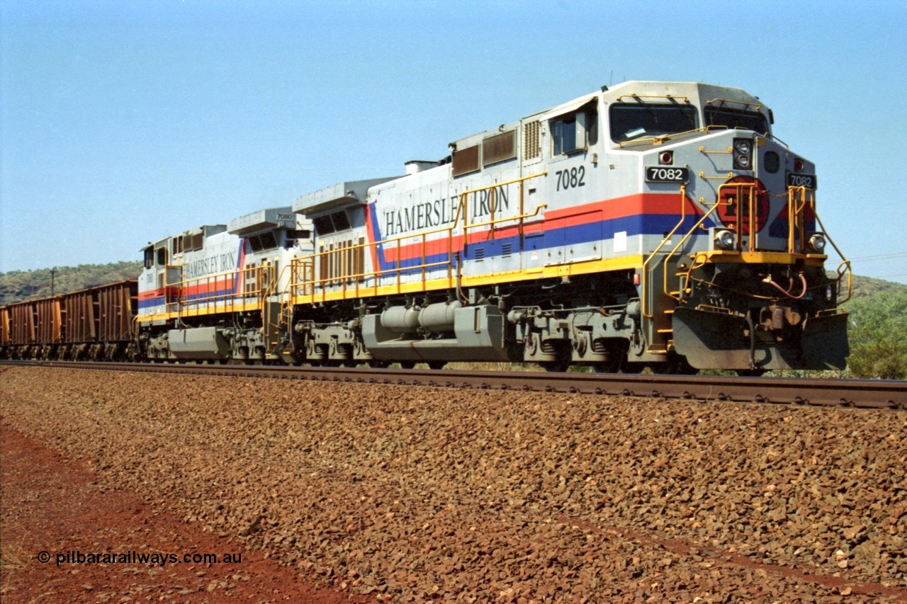 223-14
Possum Siding, Hamersley Iron loco 7082 a General Electric built Dash 9-44CW serial 47761 leads sister unit 7080 with an empty train just inside the loop waiting to effect a crew change. 21st October 2000.
Keywords: 7082;GE;Dash-9-44CW;47761;