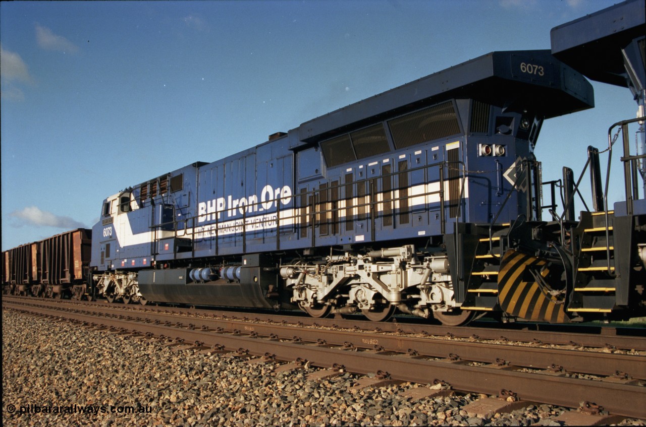 224-15
Bing siding, 6073 'Fortescue' serial 51065 a General Electric AC6000 built by GE at Erie awaits the road to depart south, radiator, steerable bogie and taper in cab side. [url=https://goo.gl/maps/KQrczNpVhAH2]GeoData[/url].
Keywords: 6073;GE;AC6000;51065;