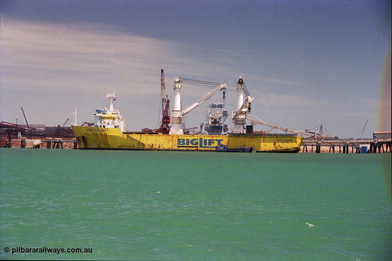 238-01
Port Hedland Harbour, heavy lift ship Happy Buccaneer, call sign PEND (IMO: 8300389) built in 1984 at Hitachi Shipbuilding Osaka Japan as class LRS X 100A1 X LMC UMS, sits at Finucane Island D Berth delivering a new shiploader for BHP Billiton. 1st November 2003. [url=https://goo.gl/maps/vWZoHTsRPsp] Geodata [/url]. Back in time here the ship cranes were only 550 tonne each, these are now 700.
Keywords: Happy-Buccaneer;Hitachi-Shipbuilding-Osaka-Japan;