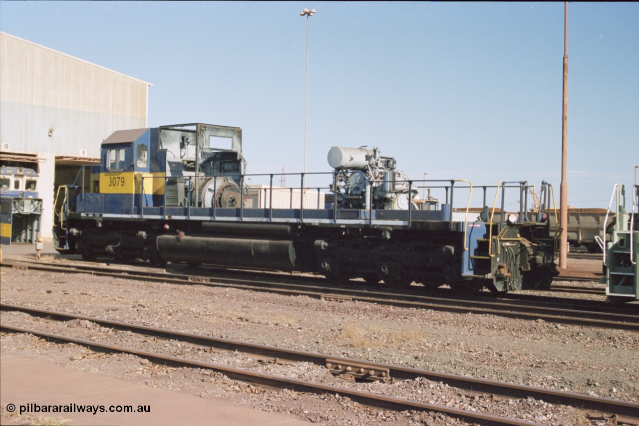 238-20
Nelson Point loco overhaul shop sees former Southern Pacific loco 3079 EMD model SD40, serial number 7861-52 with the long hood removed due to the 645 prime mover failing not long after arrival in Australia. 27th January 2004. [url=https://goo.gl/maps/rqoN9uK26rQ2] Geodata [/url].
Keywords: 3079;EMD;SD40;31542/7861-52;SP8461;