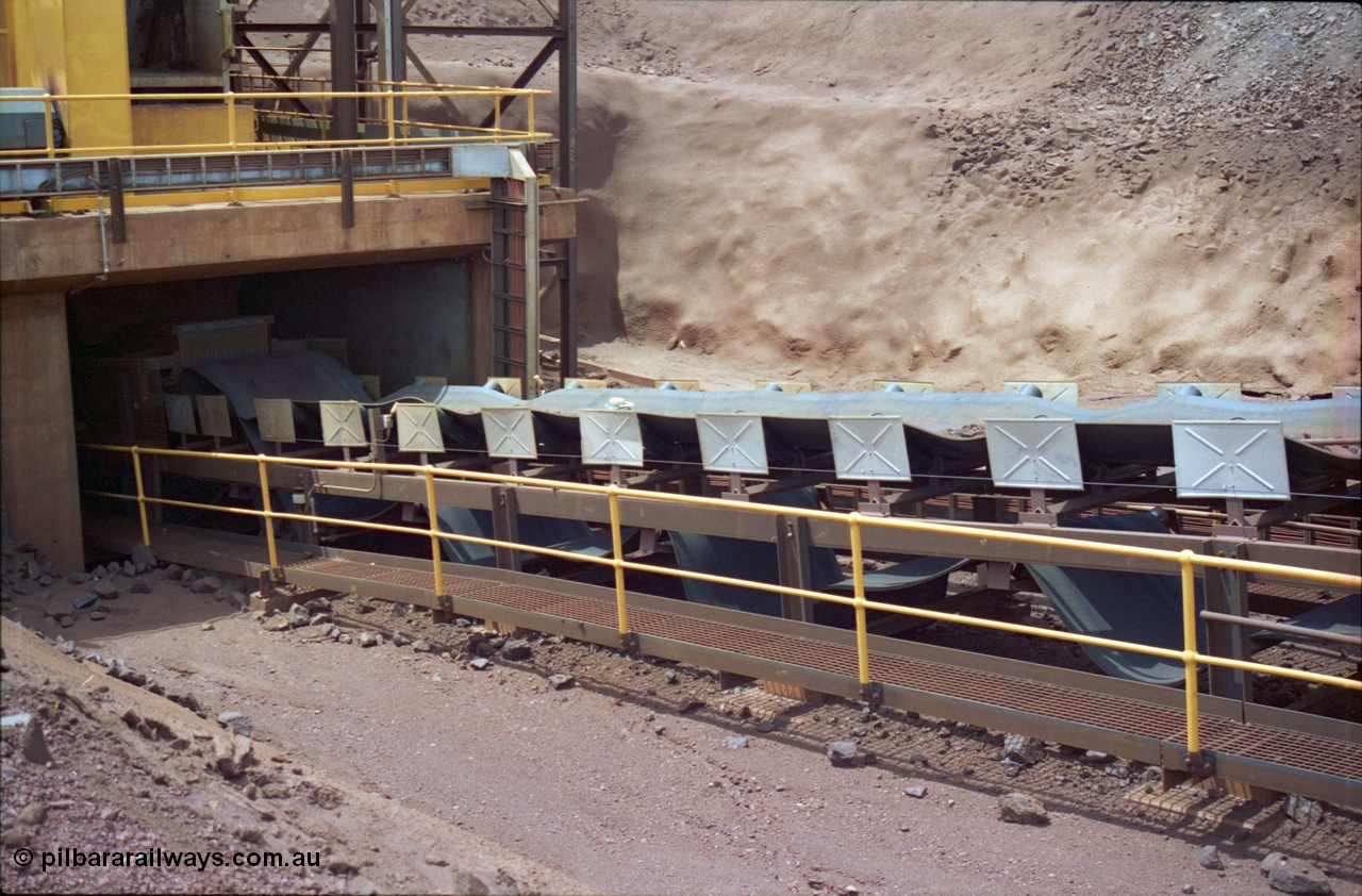 239-29
Yandi Two, conveyor belt CV202 failure to the belt on the primary crushing circuit. Shows belt rolls bunched up near exit from primary jaw type crusher. [url=https://goo.gl/maps/VrKABdiRp9P2]GeoData[/url].

