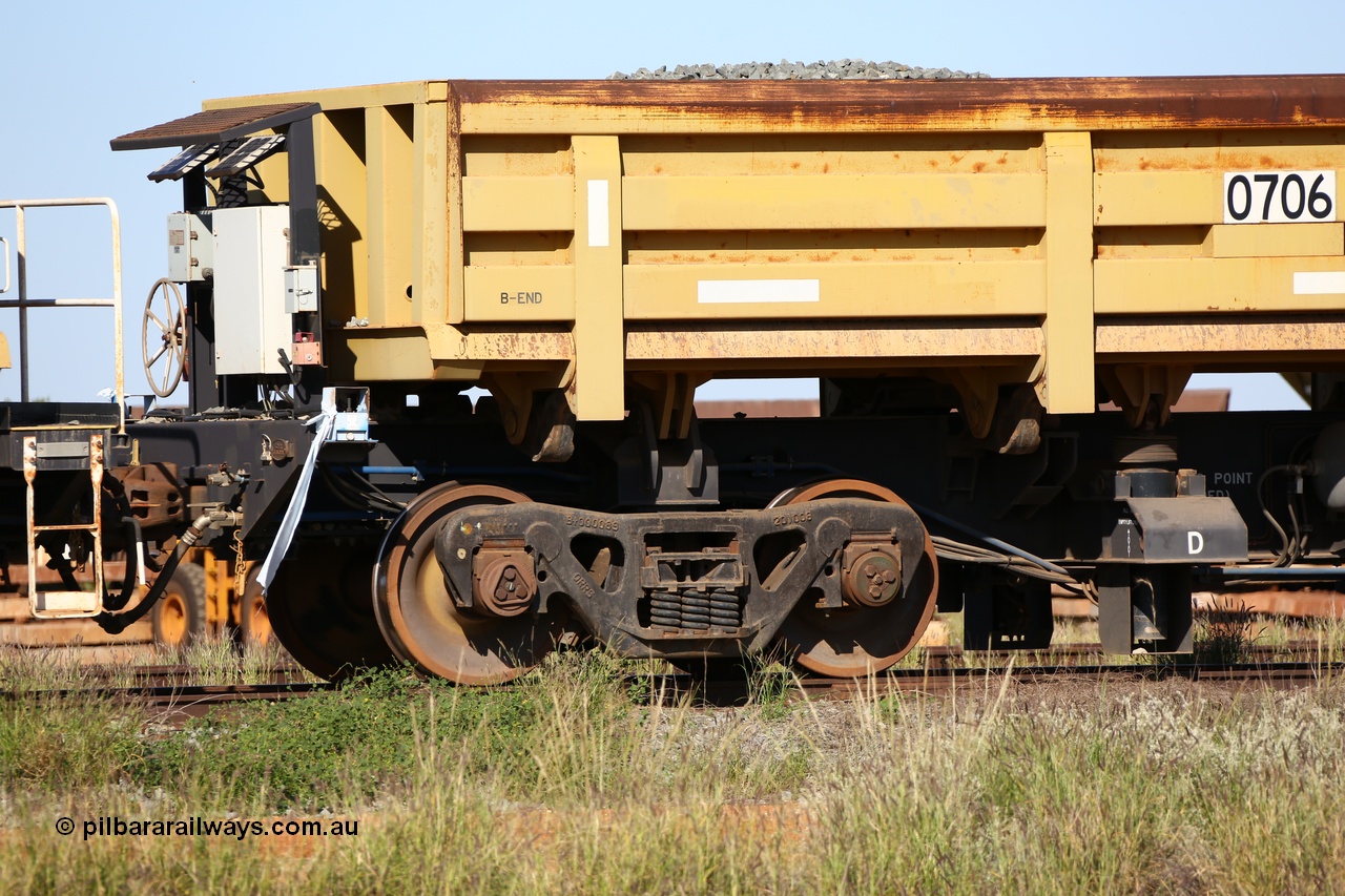 150619 9079
Flash Butt yard, CNR-QRRS of China built side dump waggons, built and delivered around 2011-12, waggon 0706 loaded with fines for sheeting, B end and bogie detail.
Keywords: CNR-QRRS-China;BHP-ballast-waggon;