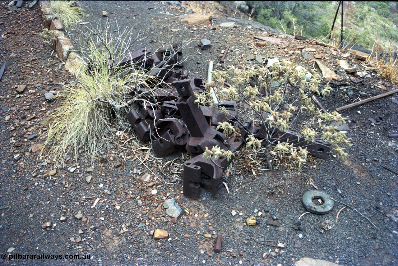 194-04
Wittenoom Gorge, Colonial Mine, pile of knuckle couplers for railway waggons.
