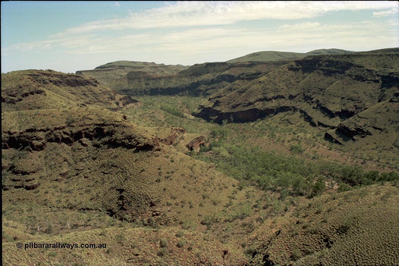 195-20
Wittenoom Gorge, view looking north along Joffre Creek, the former market garden area is in the middle, with Bolitho Rd skirting the creek.
