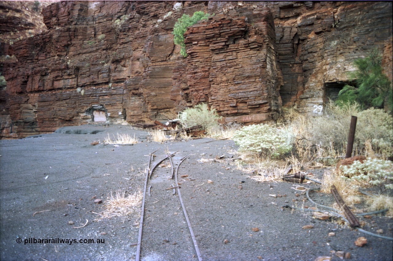 195-30
Wittenoom, West Gorge, Australian Blue Asbestos or ABA Colonial Mine, sealed up underground drive adits or entry points 27, 28 and 29, shows tramway tracks and points for entry into adit 29, entries have been sealed closed.
