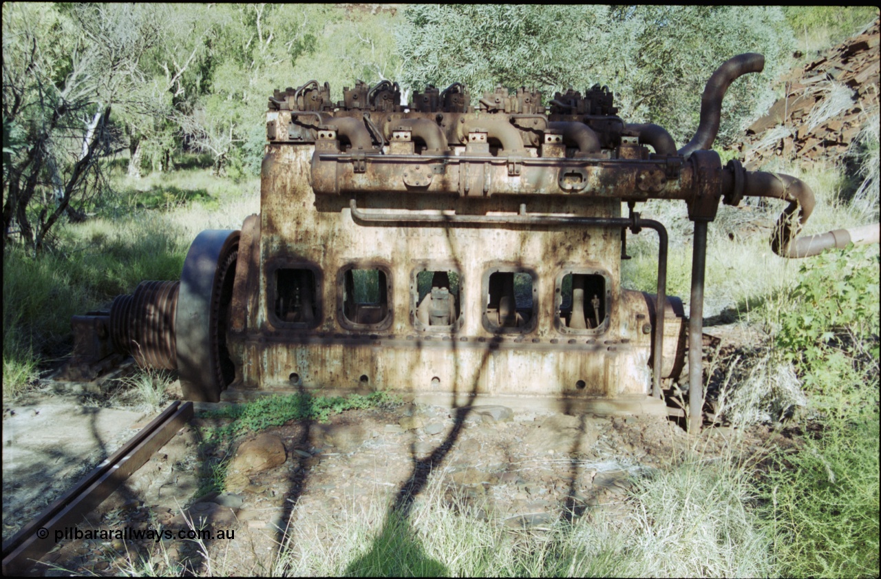 203-31
Yampire Gorge, remains of asbestos mining, 5 cylinder diesel motor with drive pulley and fly wheel, possibly an air compressor.
