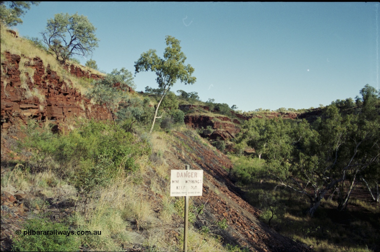 203-36
Yampire Gorge, remains of asbestos mining, former roadway over grown with sign from the National Parks Board of WA.
