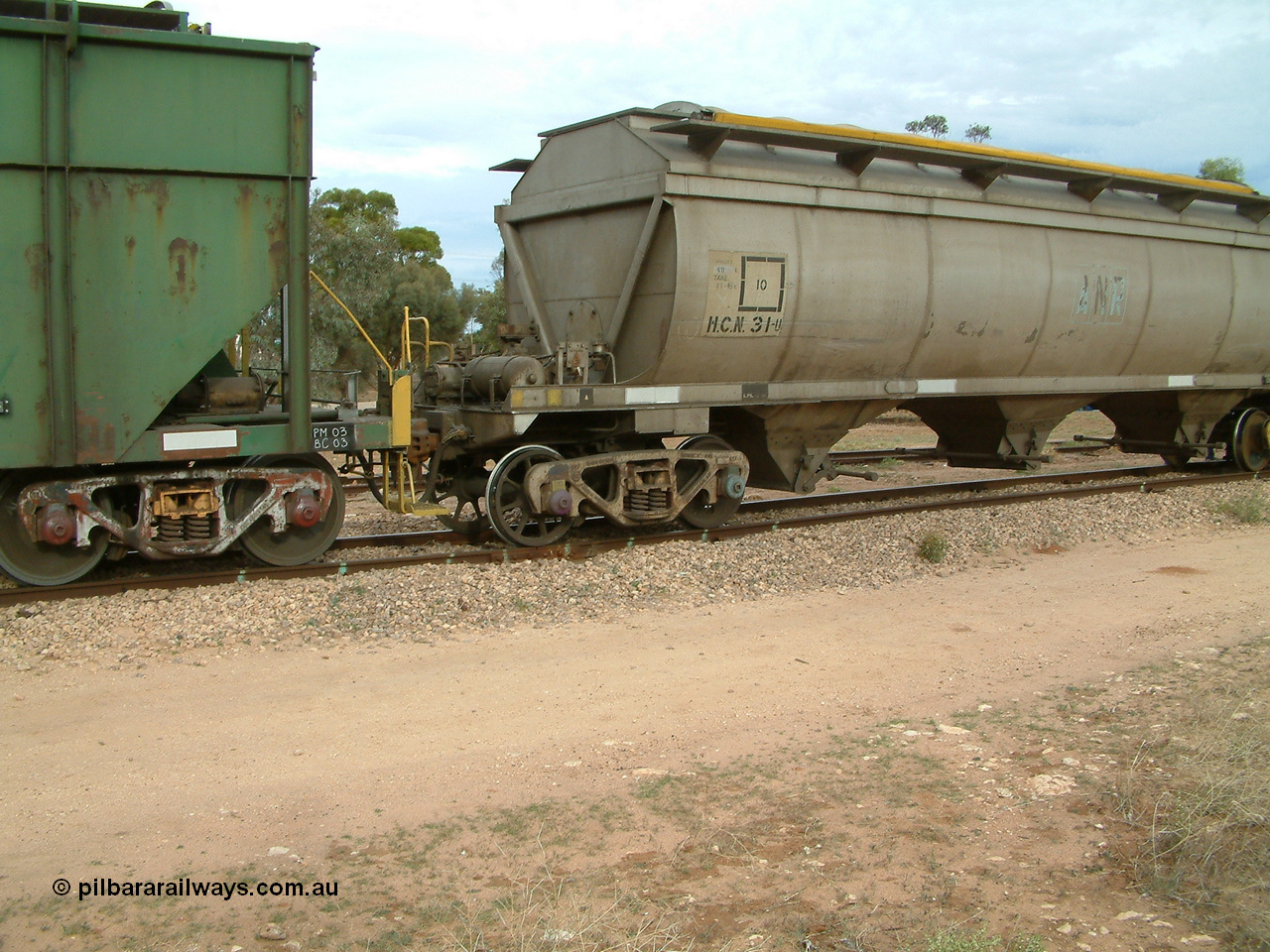 030407 082440
Wudinna, detail view of HCN type bogie wheat waggon HCN 31, modified at Islington Workshops in 1978-80 which started life as a Tulloch built NHB type iron ore hopper for the CR on the North Australia Railway in 1968-69, showing a spoke wheel and disc wheel sets in the bogie. 7th April 2003.
Keywords: HCN-type;HCN31;Tulloch-Ltd-NSW;NHB-type;