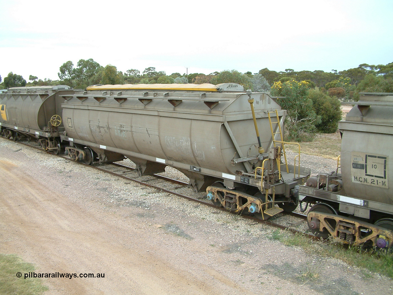 030407 100606
Minnipa, empty grain train bogie grain waggons, HCN type bogie wheat waggon HCN 22 and HCN 21, modified at Islington Workshops in 1978-80 which started life as a Tulloch built NHB type iron ore hopper for the CR on the North Australia Railway in 1968-69 with SAR Islington Workshops built HAN type bogie wheat waggon, HAN 41. 7th April, 2003.
Keywords: HCN-type;HCN22;SAR-Islington-WS;rebuild;Tulloch-Ltd-NSW;NHB-type;NHB1576;
