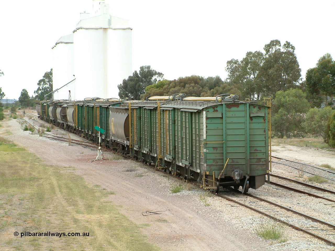 030407 100652
Minnipa, the rear portion left on the mainline as some waggons are shunted into the siding. It consists of 2 ENHV, 1 HAN, 3 ENHV, 1 HAN, 1 HBN, 1 HAN, 1 ENHG, 1 HAN, 1 ENHV, 1 HBN, 1 NHV and 2 HCN class bringing up the rear. 7th April 2003.
Keywords: ENBA-type;ENHV-type;Societe-Gregg-de-Europ;NVD-type;