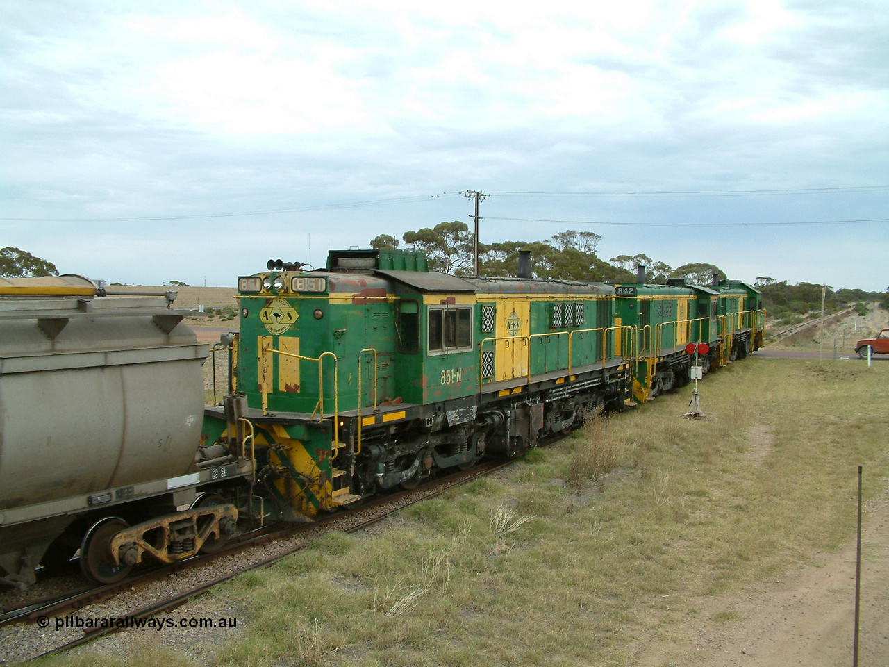 030407 100834
Minnipa, empty grain train shunts back into the grain siding with a trio of former Australian National Co-Co locomotives with rebuilt former AE Goodwin ALCo model DL531 830 class ex 839, serial no. 83730, rebuilt by Port Augusta Workshops to DA class, leading two AE Goodwin ALCo model DL531 830 class units 842, serial no. 84140 and 851 serial no. 84137, 851 having been on the Eyre Peninsula since delivered in 1962. 7th April, 2003.
Keywords: 830-class;851;84137;AE-Goodwin;ALCo;DL531;