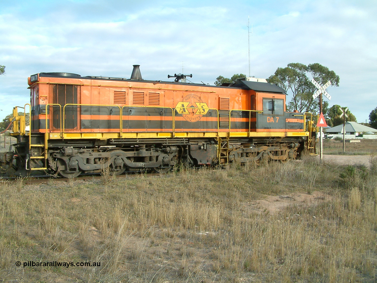 030409 080113
Warramboo, empty grain train stopped for a crew change. Rebuild unit DA 7 in Australian Southern orange and black livery shows its original heritage body style of an NSWGR 48 class 4813 AE Goodwin ALCo model DL531 serial 83713, rebuilt by Islington Workshops SA with long hood and parts from former 830 class 870 AE Goodwin ALCo model DL531 serial G6016-06 in 1998.
Keywords: DA-class;DA7;83713;Port-Augusta-WS;ALCo;DL531G/1;48-class;4813;rebuild;