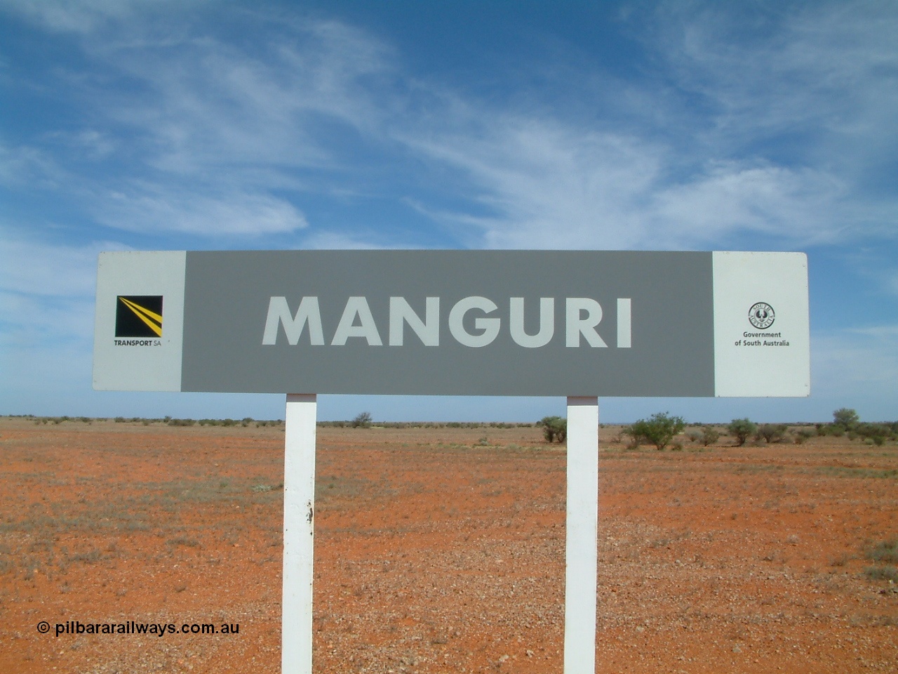 030416 110228
Manguri Siding station nameboard, located 706.5 km from the 0 datum at Coonamia and 200 km north of Tarcoola between Wirrida and Cadney Park on the Tarcoola - Alice Springs line. 16th April 2003.
