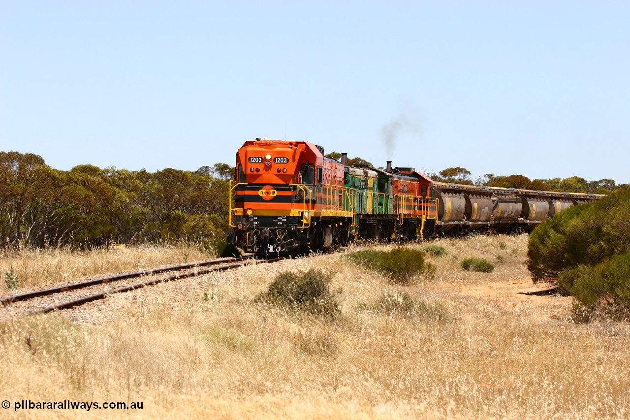 060111 2282
Murdinga, rounding the curve before entering the station environs empty grain train running north behind ARG 1200 class unit 1203, a Clyde Engineering EMD model G12C serial 65-427, one of fourteen originally built between 1960-65 for WAGR as their A class A 1513, fitted with dynamic brakes and financed by Western Mining Corporation, started working on the Eyre Peninsula in November 2004. 11th January 2006.
Keywords: 1200-class;1203;Clyde-Engineering-Granville-NSW;EMD;G12C;65-427;A-class;A1513;
