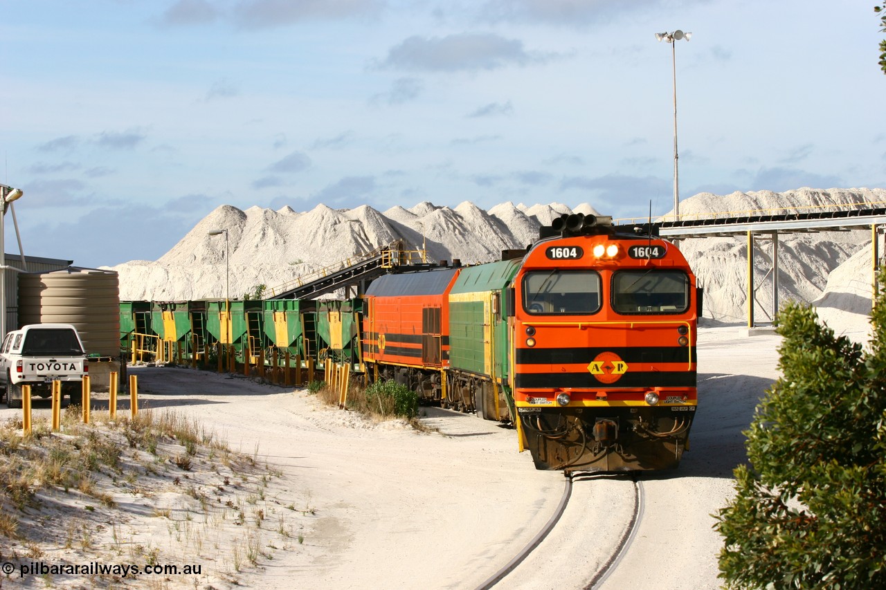 060113 2433
Thevenard, at the Gypsum Resources Australian (GRA) gypsum unloading site, 1604 leads a triple consist of Clyde Engineering EMD JL22C model 1600 / NJ class combination of 1604 serial 71-731 and originally NJ 4, NJ 3 serial 71-730 and 1601 serial 71-728 class leader NJ 1, all three units started on the Central Australia Railway in 1971 and were transferred to the Eyre Peninsula in 1981. 1604 and 1601 both renumbered in 2004. Friday 13th January 2006.
Keywords: 1600-class;1604;71-731;Clyde-Engineering-Granville-NSW;EMD;JL22C;NJ-class;NJ4;