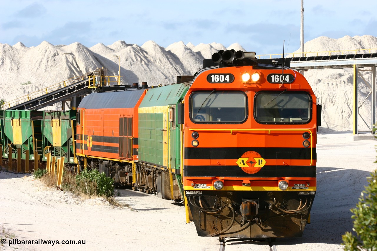 060113 2434
Thevenard, at the Gypsum Resources Australian (GRA) gypsum unloading site, 1604 leads a triple consist of Clyde Engineering EMD JL22C model 1600 / NJ class combination of 1604 serial 71-731 and originally NJ 4, NJ 3 serial 71-730 and 1601 serial 71-728 class leader NJ 1, all three units started on the Central Australia Railway in 1971 and were transferred to the Eyre Peninsula in 1981. 1604 and 1601 both renumbered in 2004. Friday 13th January 2006.
Keywords: 1600-class;1604;Clyde-Engineering-Granville-NSW;EMD;JL22C;71-731;NJ-class;NJ4;