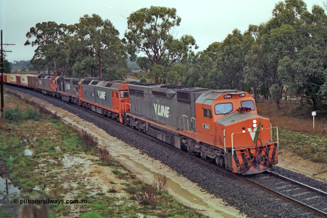 113-13
Near Gordon at Gascards Lane bridge, V/Line broad gauge up Adelaide goods train 9150 behind the quad CGCG combo of C classes C 506 Clyde Engineering EMD model GT26C serial 76-829, G classes G 538 Clyde Engineering EMD model JT26C-2SS serial 89-1271, C 510 serial 76-833 and G 513 serial 85-1241, in miserable conditions, poor quality.
Keywords: C-class;C506;Clyde-Engineering-Rosewater-SA;EMD;GT26C;76-829;
