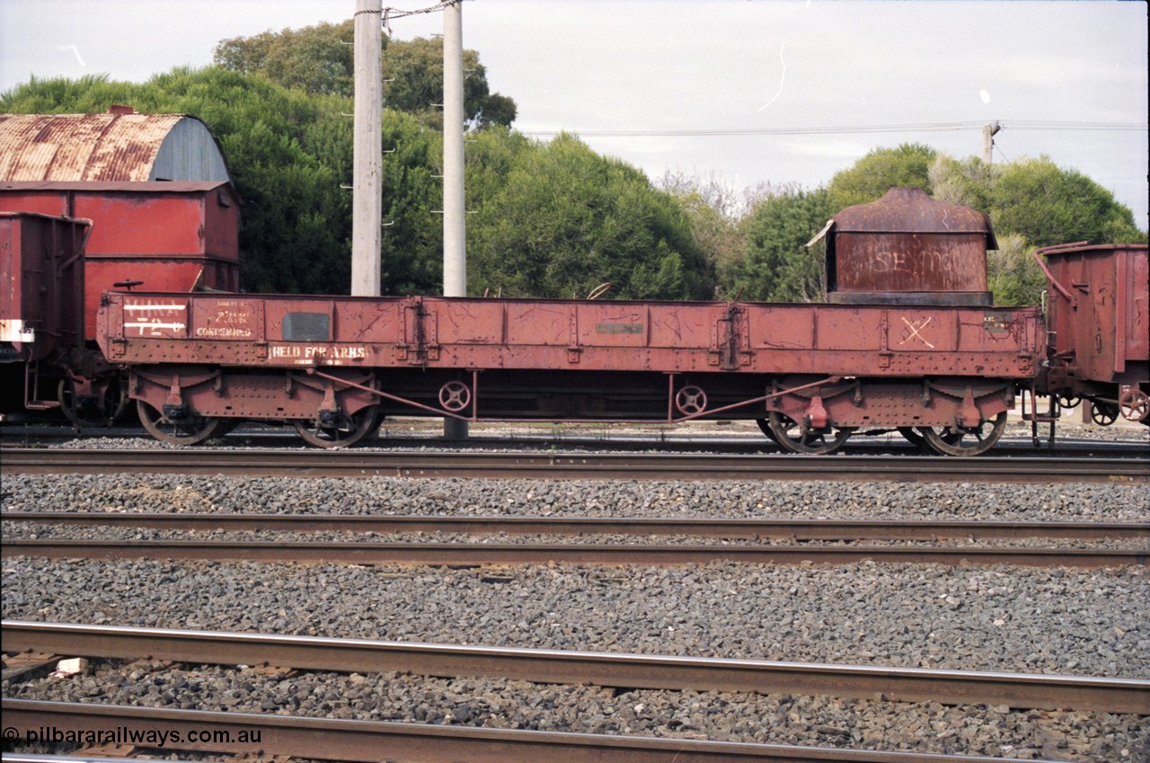 117-13
Benalla, stored broad gauge waggons, VHNA type bogie ballast waggon with plate frame bogies VHNA 72, stencilled 'Held for ARHS'. Built by Newport Workshops in June 1913 at QN type, in February 1981 recoded to VHNA type and placed off register in May 1984. 
Keywords: VHNA-type;VHNA72;Victorian-Railways-Newport-WS;QN-type;