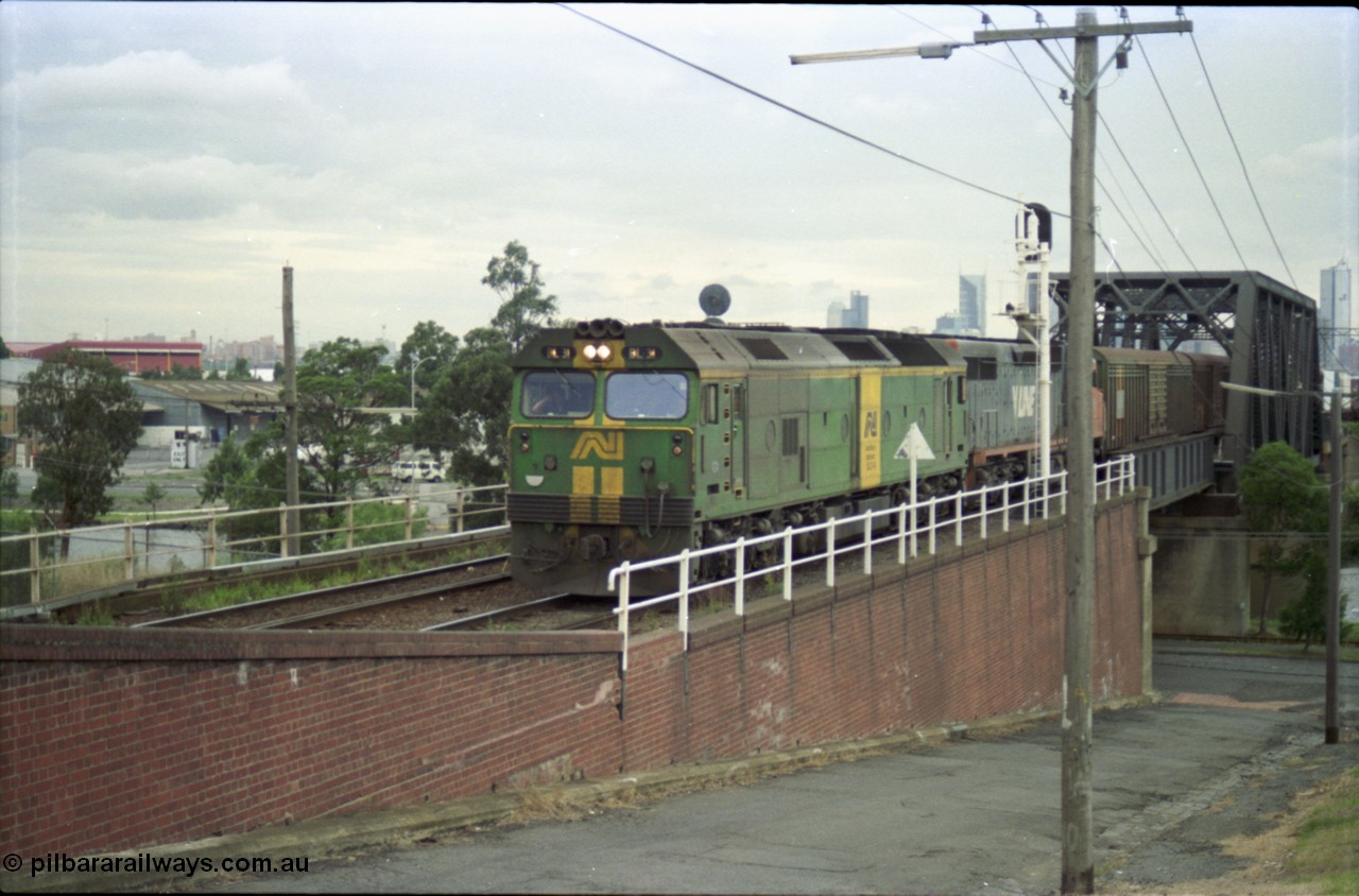 119-14
Maribyrnong River, Bunbury St Tunnel, Australian National broad gauge loco BL class BL 31 Clyde Engineering EMD model JT26C-2SS serial 83-1015 and V/Line C class C 509 Clyde Engineering EMD model GT26C serial 76-832 work down Adelaide goods train 9149 over the Maribyrnong River.
Keywords: BL-class;BL31;83-1015;Clyde-Engineering-Rosewater-SA;EMD;JT26C-2SS;