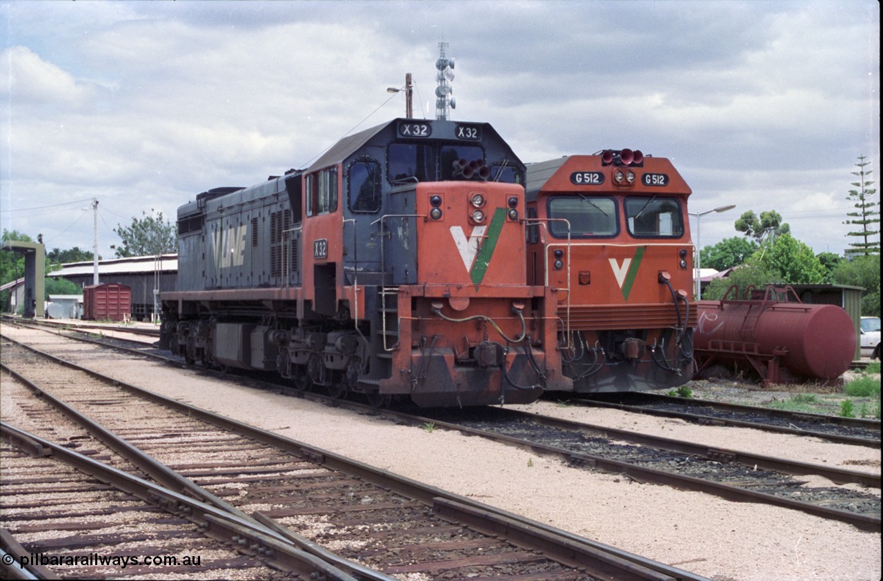 132-21
Mildura loco depot V/Line broad gauge X class X 32 Clyde Engineering EMD model G16C serial 66-485 and G class G 512 Clyde Engineering EMD model JT26C-2SS serial 84-1240.
Keywords: X-class;X32;Clyde-Engineering-Granville-NSW;EMD;G16C;66-485;