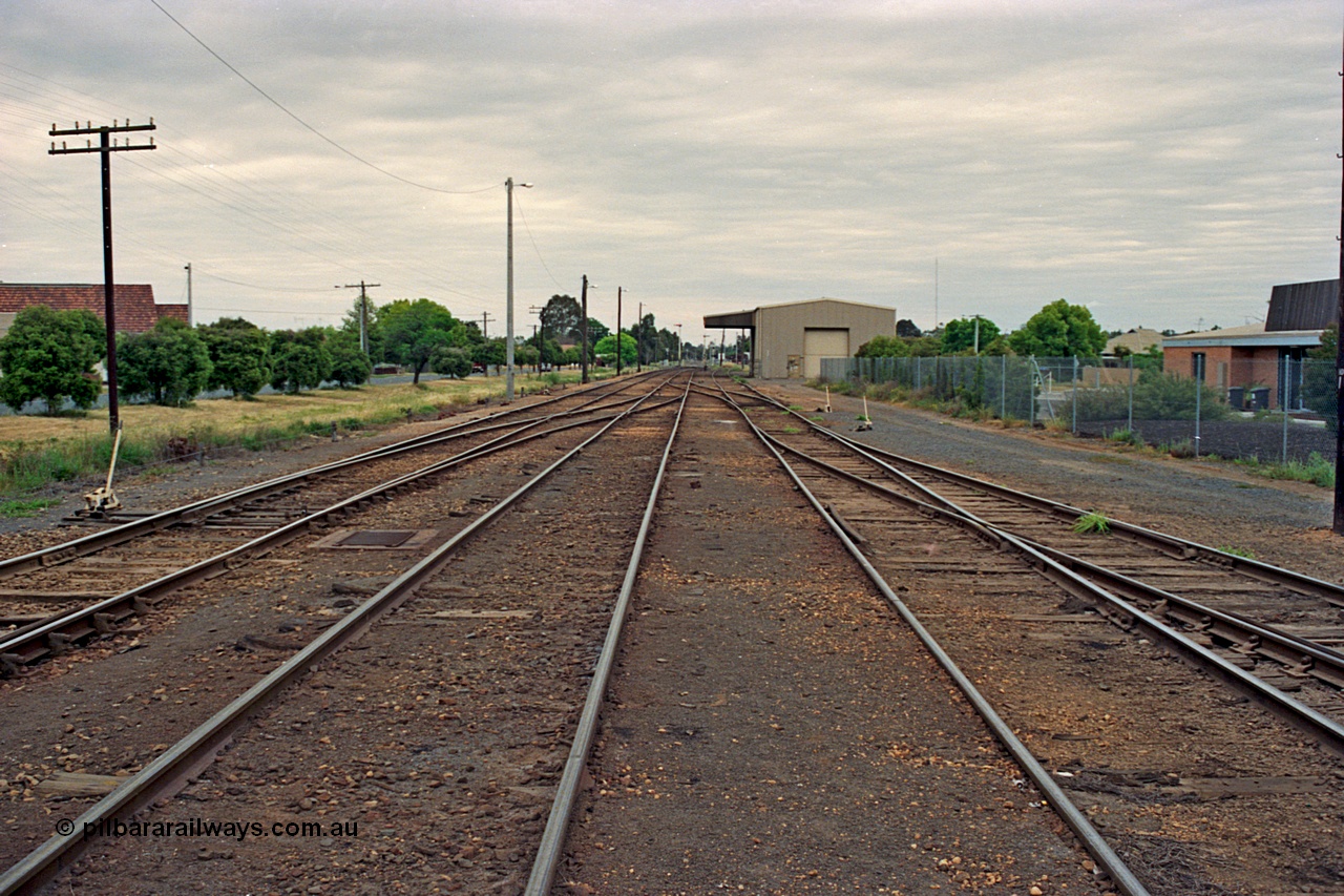 175-10
Shepparton yard overview looking south, at the far left just visible are the points to the Weighbridge Sidings with a cross-over from No.1 to No.2 Roads, start of yard ladder on the right and disused loading shed with canopy in the background.
