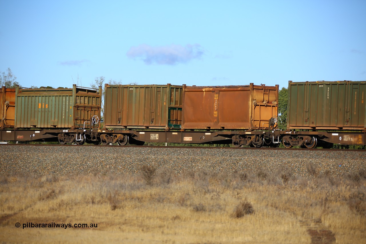 161111 2412
Kalgoorlie, Malcolm freighter train 5029, waggon AQNY 32200 one of sixty two waggons built by Goninan WA in 1998 as WQN type for Murrin Murrin container traffic with an original style sulphur container S197A 947 with original style door and sliding tarpaulin and an undecorated Bis Industries hard-top 25U0 type sulphur container BISU 100037.
Keywords: AQNY-type;AQNY32200;Goninan-WA;WQN-type;