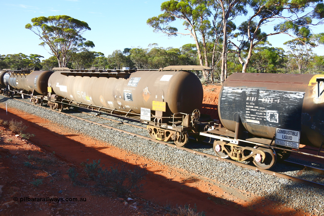 190109 1690
Binduli, empty fuel train 4445, ATPF type tank waggon ATPF 584, built by Westrail Midland Workshops 1980 for Shell as WJP type, 80.66 kL one compartment one dome, fitted with type F InterLock couplers. Under Viva Energy ownership.
Keywords: ATPF-type;ATPF584;Westrail-Midland-WS;WJP-type;