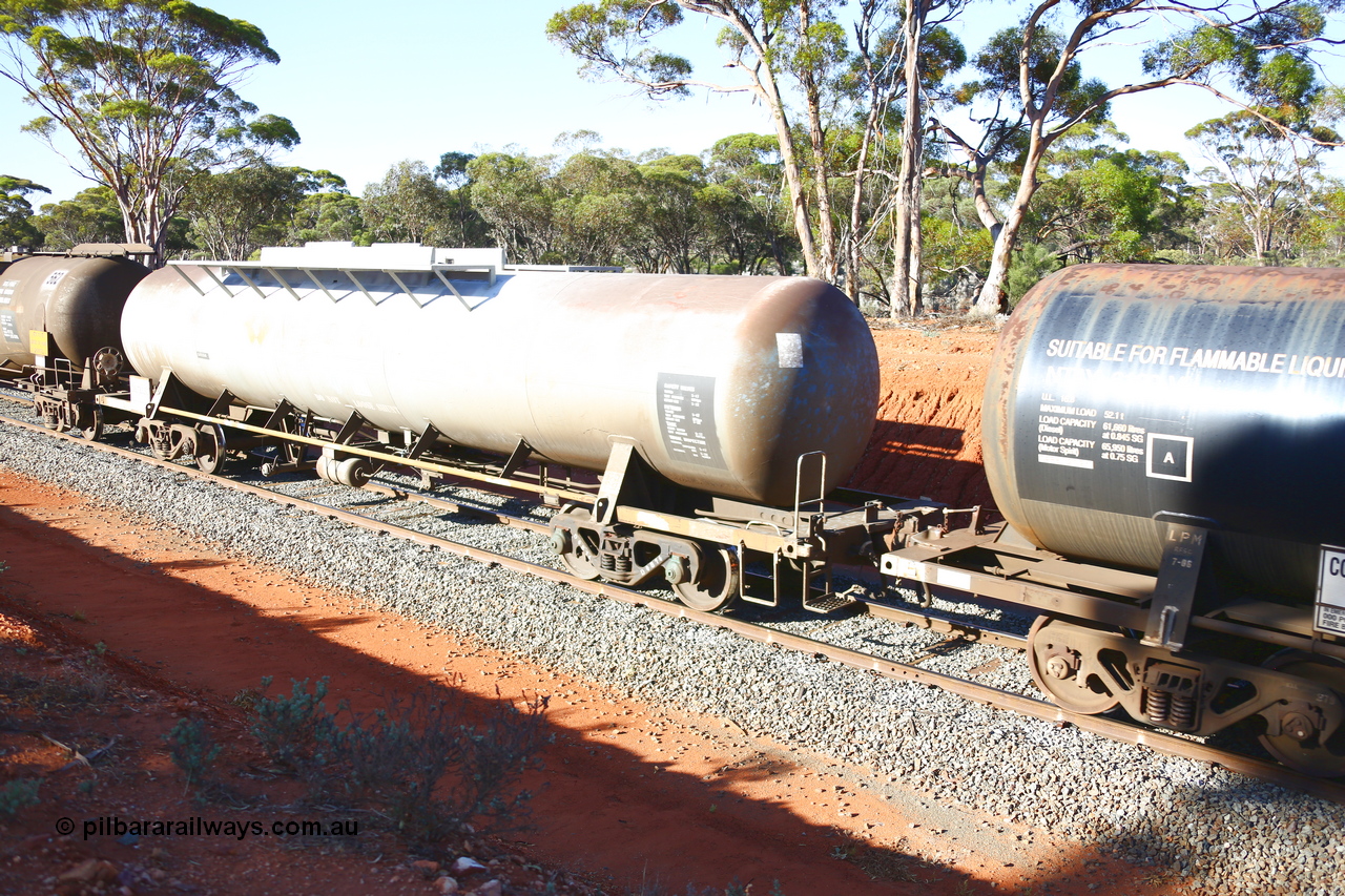 190109 1702
Binduli, empty fuel train 4445, RHTY type tank waggon RHTY 663, one of twelve such waggons built by Industrial Engineering Qld in 1976 for Victorian Railways as TWX type crude benzene tank 56,000 litres. Recoded to VTHX in 1979. After a period of storage ended up in National Rail ownership for Alice Springs traffic, now Pacific National ownership.
Keywords: RHTY-type;RHTY663;Indeng-Qld;TWX-type;VTHX-type;