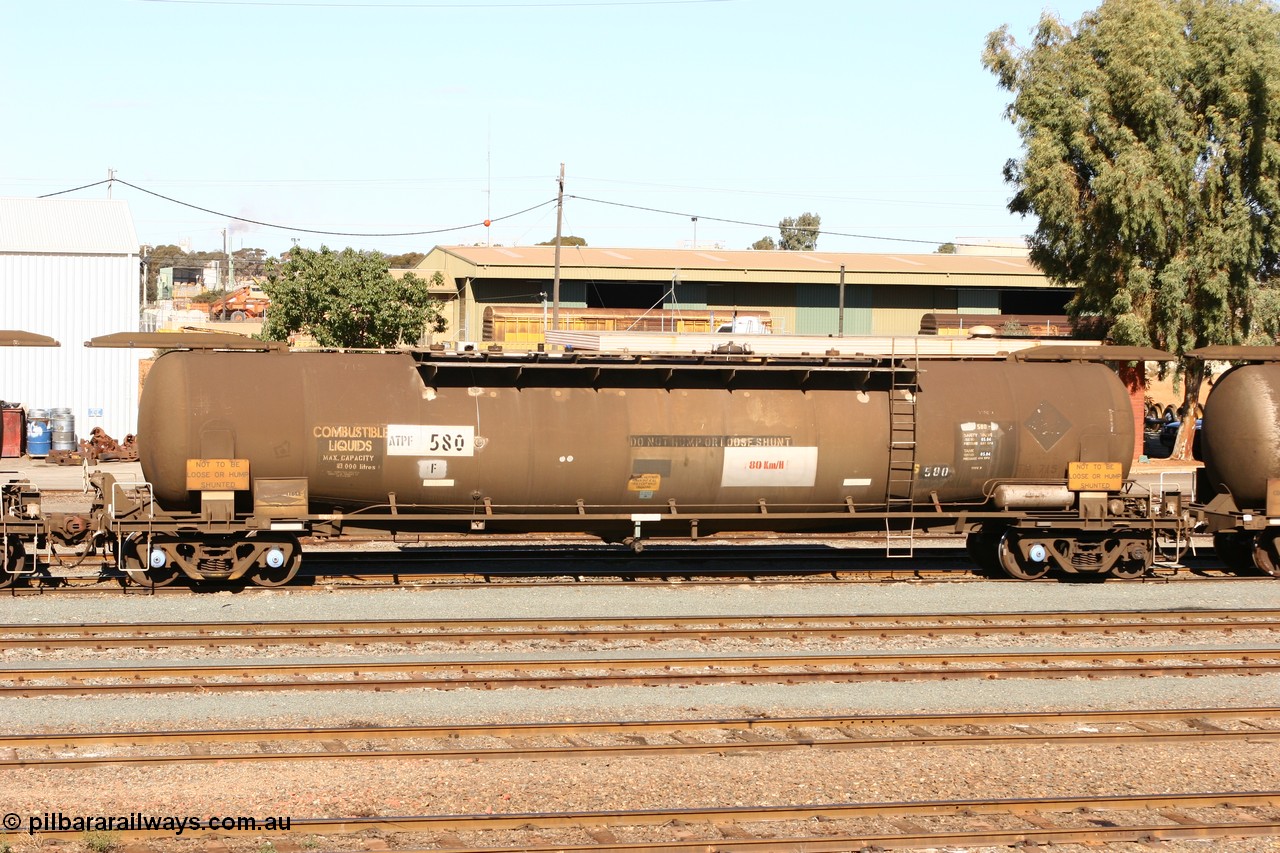 070529 9419
West Kalgoorlie, ATPF 580 fuel tank waggon built by WAGR Midland Workshops 1976 for Shell as type WJP, 80.66 kL one compartment one dome, capacity of 80500 litres, it also spent time in SA in 1985, fitted with type F InterLock couplers, Shell Fleet no. TR715 still visible.
Keywords: ATPF-type;ATPF580;WAGR-Midland-WS;WJP-type;