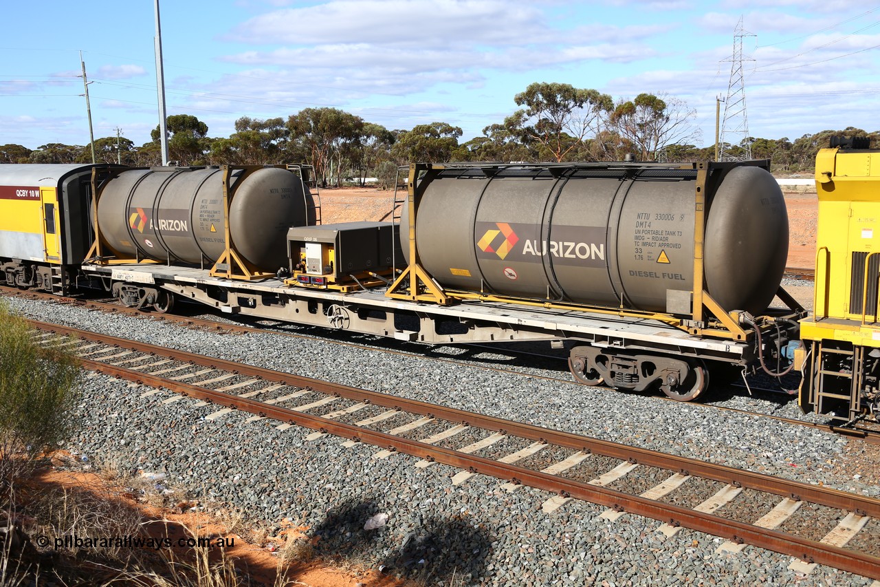 160525 4943
West Kalgoorlie, Aurizon intermodal train 2MP1. Inline fuelling waggon QQFY 4271, originally built for Commonwealth Railways in 1976 by Perry Engineering SA as type RMX, recoded to AQMX, 70 tonne bogies became AQMY, then RQMY, to QR National in 2007. Seen here with two 30' diesel fuel tanktainers from Nantong Tank Container Company, NTTU 330006 and NTTU 330001 each with a 30800 litre capacity, and fuel transfer or pump unit QRIP 06.
Keywords: QQFY-type;QQFY4271;Perry-Engineering-SA;RMX-type;AQMX-type;AQMY-type;RQMY-type;