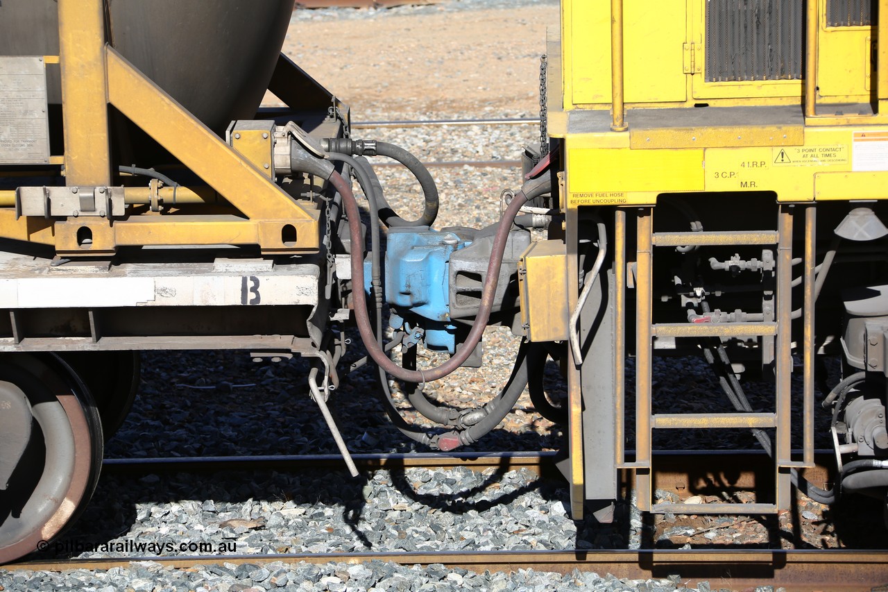 160525 4945
West Kalgoorlie, Aurizon intermodal train 2MP1. Coupling between second unit locomotive and the inline fuelling waggon QQFY 4271, shows the MU or Multiple Unit red cable going into the socket with the cream cap on the waggon and the red cap on the loco, behind that is the crimp fitting is the in-line fuel hose between waggon and the loco along with train air pipe and coupling.
Keywords: QQFY-type;QQFY4271;Perry-Engineering-SA;RMX-type;AQMX-type;AQMY-type;RQMY-type;
