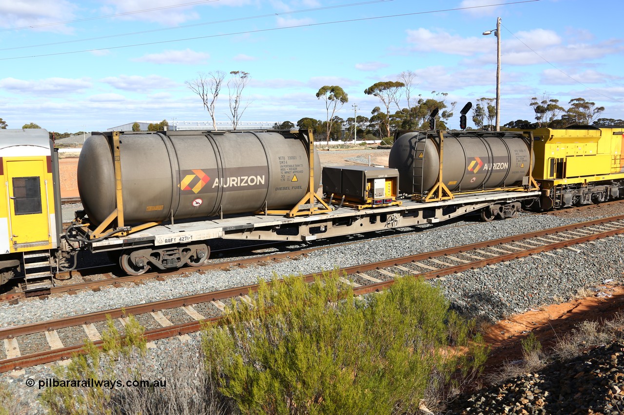 160525 4951
West Kalgoorlie, Aurizon intermodal train 2MP1. Inline fuelling waggon QQFY 4271, originally built for Commonwealth Railways in 1976 by Perry Engineering SA as type RMX, recoded to AQMX, 70 tonne bogies became AQMY, then RQMY, to QR National in 2007. Seen here with two 30' diesel fuel tanktainers from Nantong Tank Container Company, NTTU 330006 and NTTU 330001 each with a 30800 litre capacity, and fuel transfer or pump unit QRIP 06.
Keywords: QQFY-type;QQFY4271;Perry-Engineering-SA;RMX-type;AQMX-type;AQMY-type;RQMY-type;