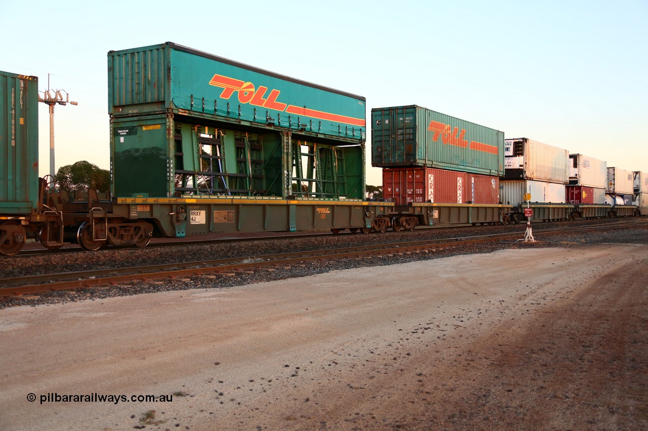 160523 2722
Parkeston, 1PM5 intermodal train, RRXY 4 a 5-pack well waggon set, one of eleven built by Bradken Qld in 2002 for Toll from a Williams-Worley design with a motley load of double stacked boxes off all decrees.
Keywords: RRXY-type;RRXY4;Williams-Worley;Bradken-Rail-Qld;