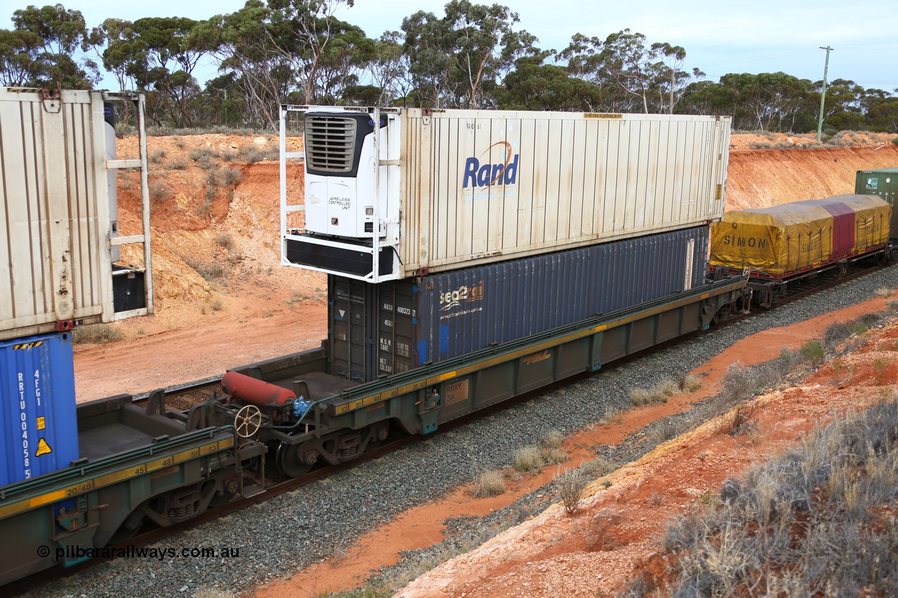160524 3750
West Kalgoorlie, 2PM6 intermodal train, RRXY 3 platform 5 of 5-pack well waggon set, one of eleven built by Bradken Qld in 2002 for Toll from a Williams-Worley design with a 46' RAND Refrigerated Logistics reefer RAND 61 on top of a SCF sea2rail 40' box AUSU 408323. 
Keywords: RRXY-type;RRXY3;Williams-Worley;Bradken-Rail-Qld;