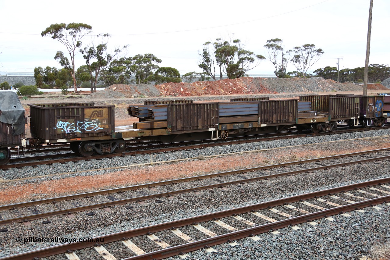 160524 4311
West Kalgoorlie, 1MP2 steel train, RKWY 2871, originally built by Transfield WA as part of a batch of two hundred GOX type waggons in 1975, recoded to AOOX, later converted to steel traffic. Loaded with long products.
Keywords: RKWY-type;RKWY2871;Transfield-WS;GOX-type;AOOX-type;AKOX-type;