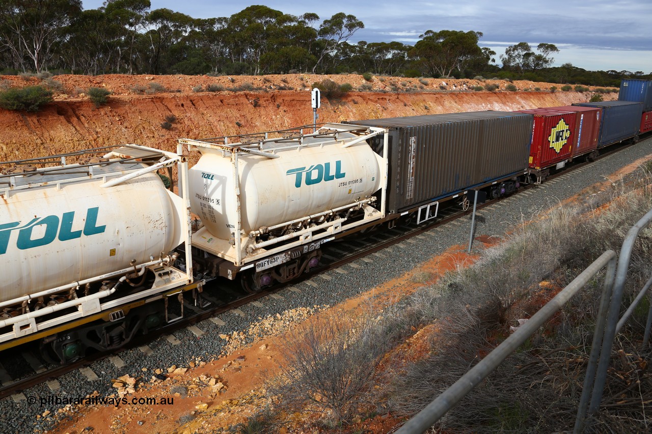 160526 5222
West Kalgoorlie, 4PM6 intermodal train, RQFY 63 container waggon, built by Victorian Railways Bendigo Workshops in 1980 as a batch of seventy five VQFX type skeletal container waggons, recoded to VQFY, then RQFF, then 2CM bogies fitted in 1995, 20' Jamieson built tanktainer Toll JTSU 011395 and plain blue SCF Austrans 40' box.
Keywords: RQFY-type;RQFY63;Victorian-Railways-Bendigo-WS;VQFX-type;RQFF-type;