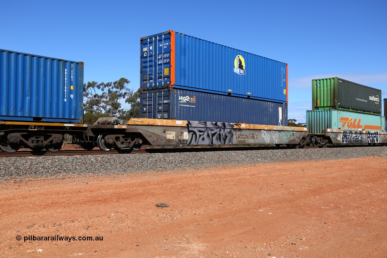 160528 8428
Binduli, intermodal train 6PM6, RQZY 7054 platform 1 of five unit bar coupled well container waggon set built in a batch of thirty two by Goninan NSW in 1995/96, loaded with an SCF sea2rail 40' 4EG1 type container TSPD 408102 double stacked with Royal Wolf 40' 4FG1 type container RWTU 941308.
Keywords: RQZY-type;RQZY7054;Goninan-NSW;