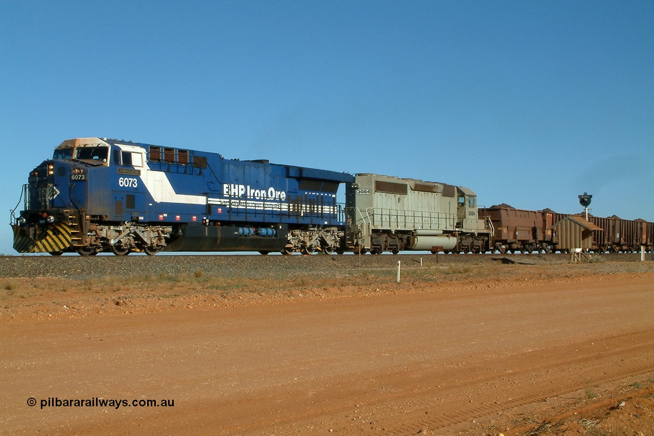 040802 155428r
Bing Siding, BHP GE AC6000 locomotive 6073 'Fortescue' leads EMD SD40-2 unit 3084 serial 786263-35 originally Union Pacific UP 3643 with a loaded train running through Bing 2nd August 2004.
Keywords: 6073;GE;AC6000;51065;