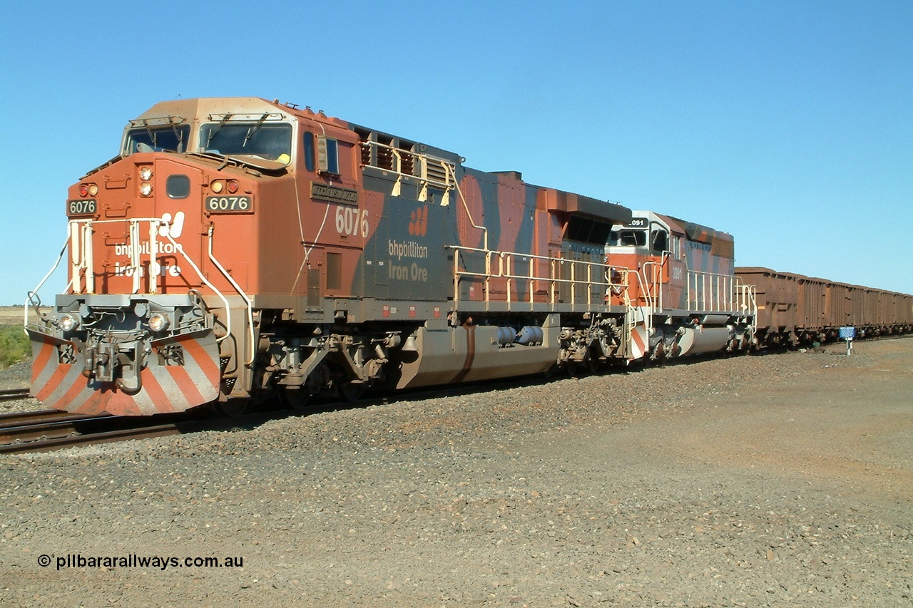 040810 150446r
Shaw Siding, BHP Billiton GE AC6000 6076 'Mt Goldsworthy' serial 51068 leads an all bubble paint quin consist on the main with EMD SD40R 3091 serial 31496 originally Southern Pacific SD40 SP 8415 and mid train units CM40-8M 5636 leading newly delivered SD40R units 3095 and 3096 10th August 2004.
Keywords: 6076;GE;AC6000;51068;