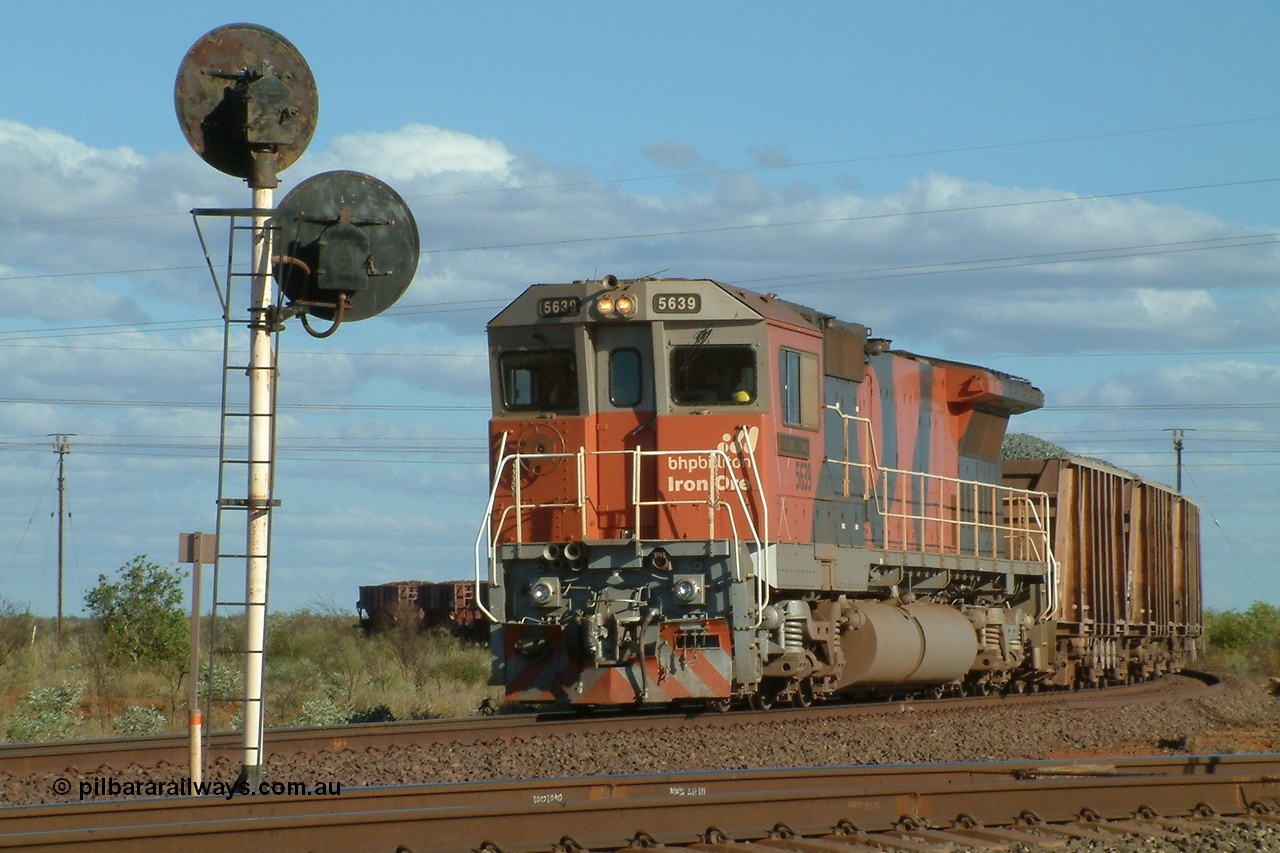 040812 155940r
Goldsworthy Junction BHP Billiton Goninan GE rebuild CM40-8M 5639 'Corunna Downs' serial 8281-03/92-128 is on the Yarrie line with a mixed ballast and loaded ore train awaiting a Pilot to come out from Hedland to pilot the train into Nelson Point yard at 1600 hrs 12th August 2004.
Keywords: 5639;Goninan;GE;CM40-8M;8281-03/92-128;rebuild;AE-Goodwin;ALCo;C636;5459;G6027-3;