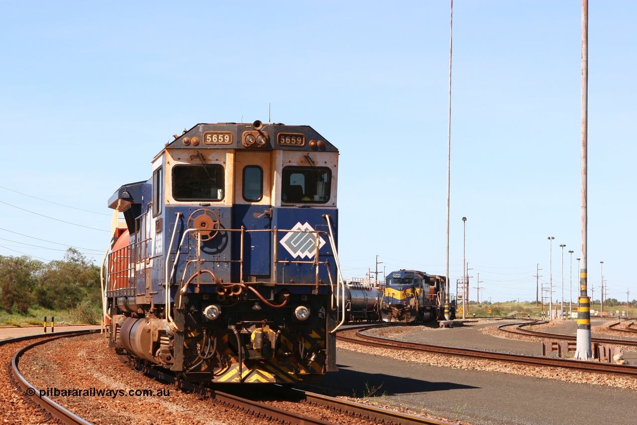 060415 3450r
Nelson Point yard, BHP Goninan GE rebuild CM40-8M 5659 'Kobe' serial 8412-04 / 94-150 with a rake of loaded 100 kL fuel waggons waiting access to shunt for the evening departure and Yard Pilots EMD SD40 units 3080 and 3091 15th April 2006.
Keywords: 5659;Goninan;GE;CM40-8M;8412-04/94-150;rebuild;AE-Goodwin;ALCo;M636C;5483;G6061-4;