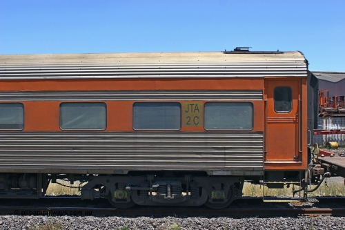 051230 1031
Melbourne, Australian Southern Railroad JTA type crew accommodation coach JTA 2, originally built in 1951 by SAR Islington Workshops as corten steel V&SAR Joint Stock twinette sleeping car Mokai for The Overland. Recoded to JTA 2 in 1987. Written off and sold in 1995. Converted to ASR crew car 1999? Converted to GWA liveried ADFY 7 in 2014.
Keywords: JTA-type;JTA2;SAR-Islington-WS;Mokai;